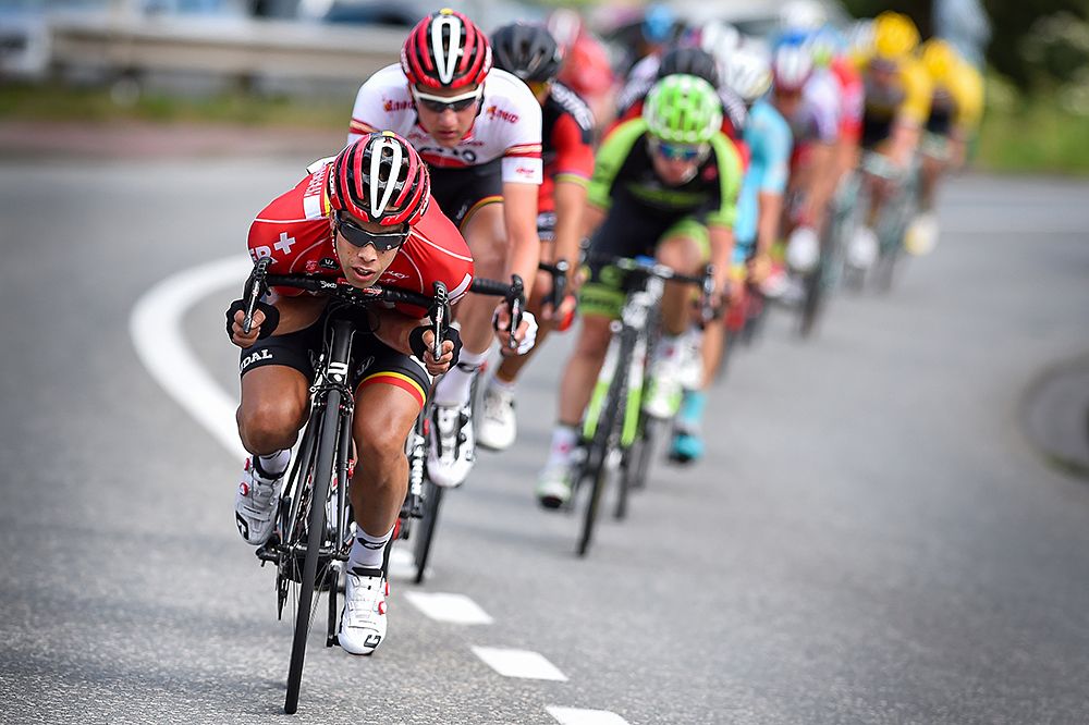 Jens Debusschere leads the peloton for overall leader Tim Wellens