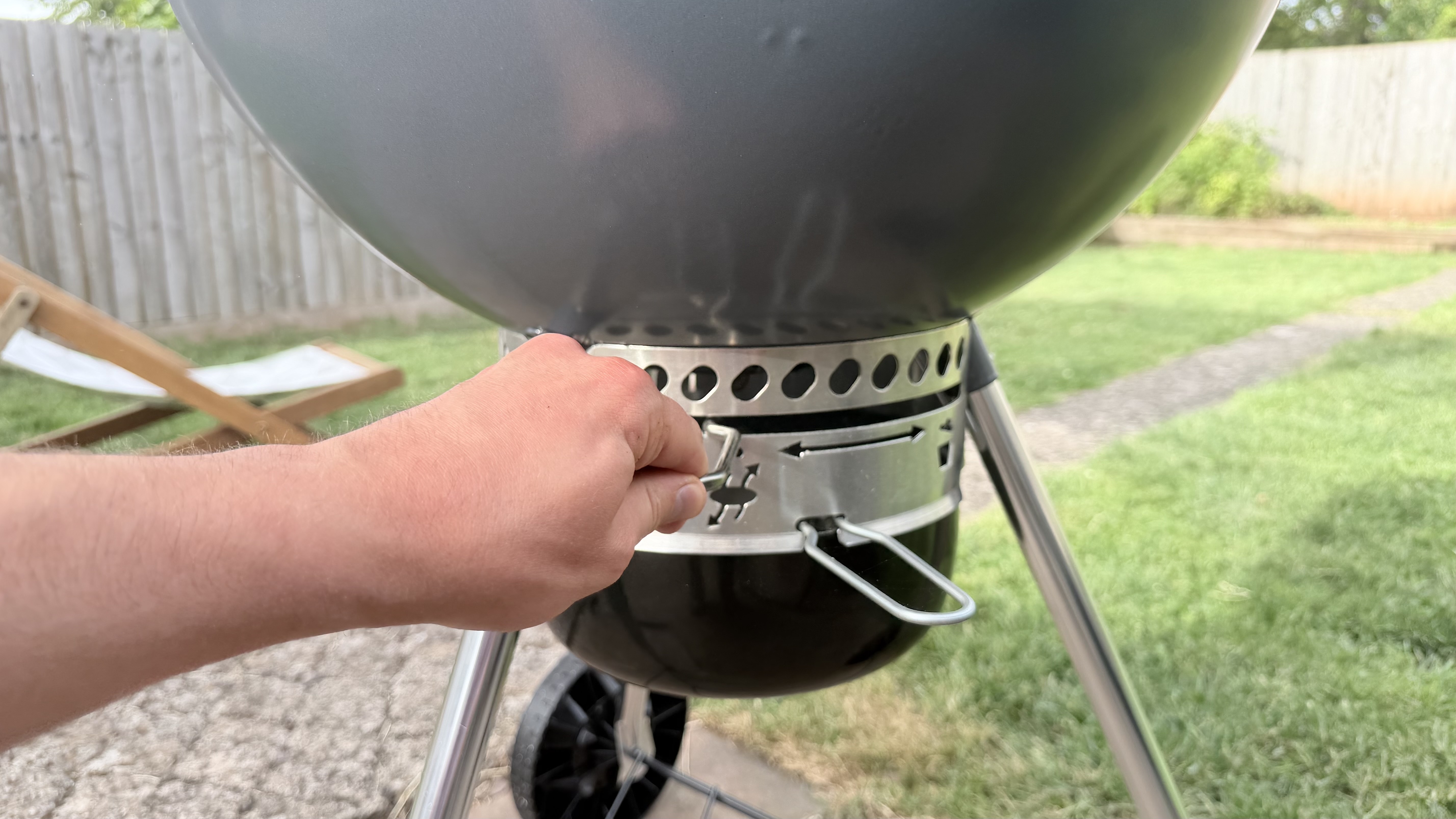 The Weber Master-Touch with the One-Touch cleaning system being used by hand