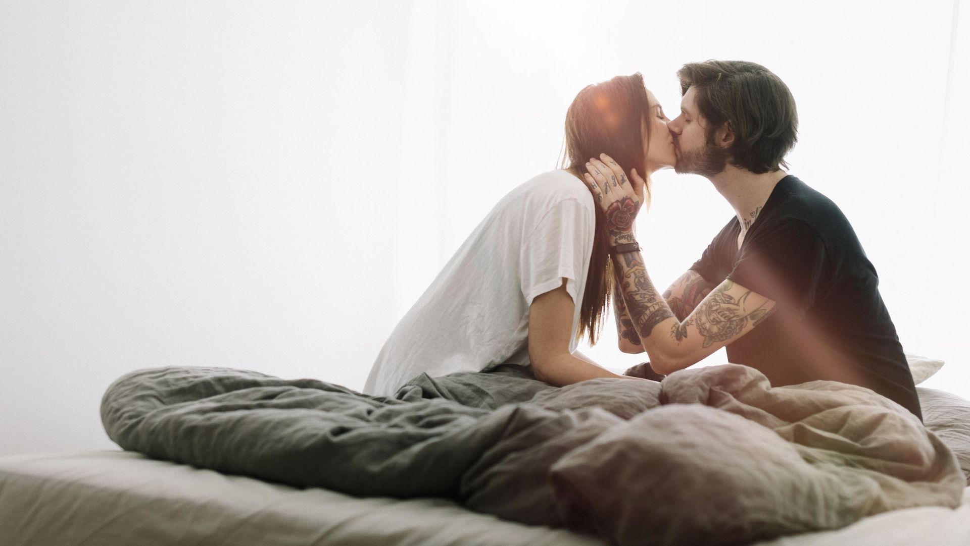 Couple Sitting Down Kissing