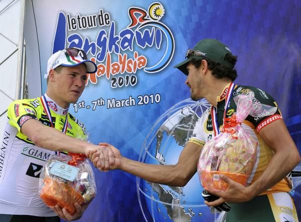 Dmytro Grabovskyy (3rd, ISD - Neri) and Alex Candelario (2nd, Kelly Benefit Strategies) shake hands on the podium