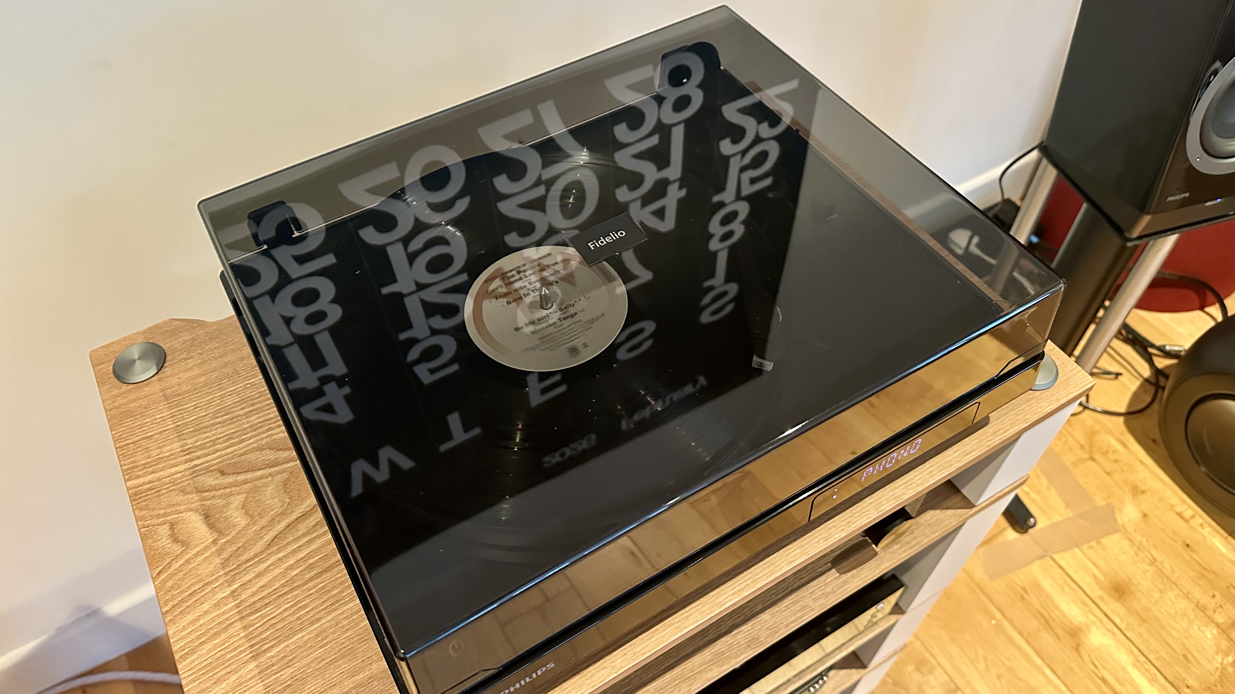 Philips Fidelio FT1 turntable closeup showing the tonearm, plinth, stylus and CD mechanism