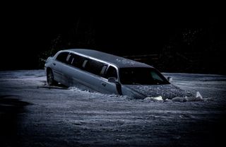 The limo sinking into the frozen lake