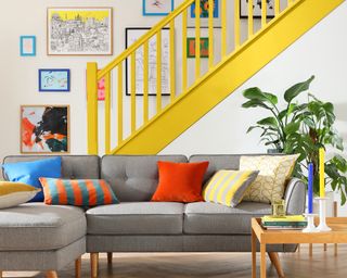 Yellow staircase with scandi inspired furniture in living room