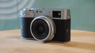 Fujifilm X100V on a wooden surface