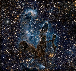 An infrared view of the Eagle Nebula reveals many of the stars at the heart of its pillars.