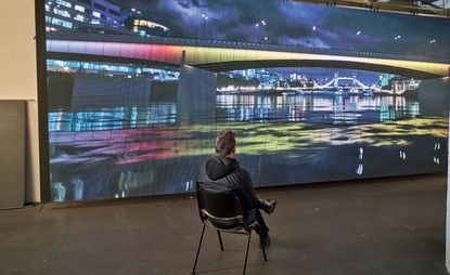 Leo Villarreal with an Illuminated River projection