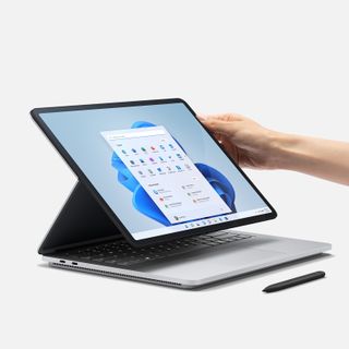 Surface Studio Laptop with hand touching screen