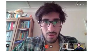 A man appears in the Google Hangouts interface during a video call