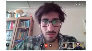 A man appears in the Google Hangouts interface during a video call 