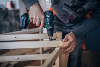 Man using cordless drill
