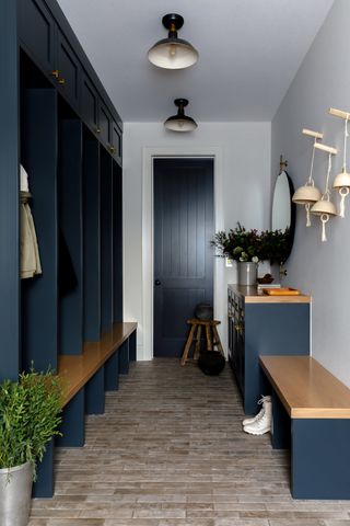 Entryway with dark navy storage and matching console.