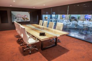 Large conferencing spaces feature Crestron Flex tabletop kit and Dell interactive flat panel displays.