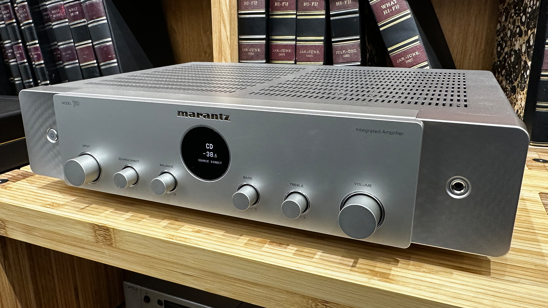 Marantz Model 70 integrated amplifier on wooden hi-fi rack in front of bookcase