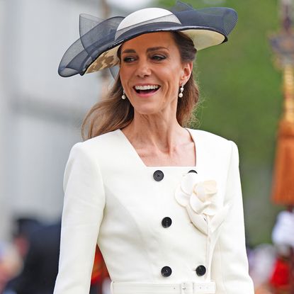 Princess Kate wearing a white blazer dress at a garden party