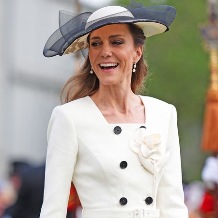 Princess Kate wearing a white blazer dress at a garden party