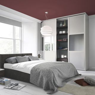 bedroom with white flooring and wardrobe