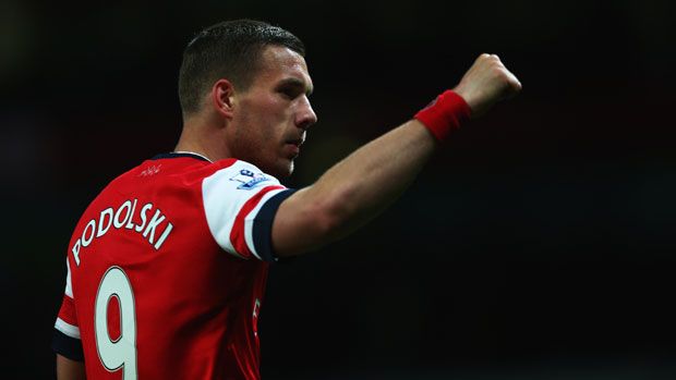 Arsenal&amp;#039;s Lukas Podolski celebrates at the Emirates