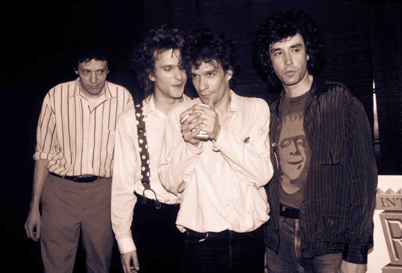 The Replacements (Chris Mars, Paul Westerberg, Slim Dunlap, and Tommy Stinson) pose together.