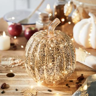 halloween decorating ideas: candle sconce shaped as a pumpkin