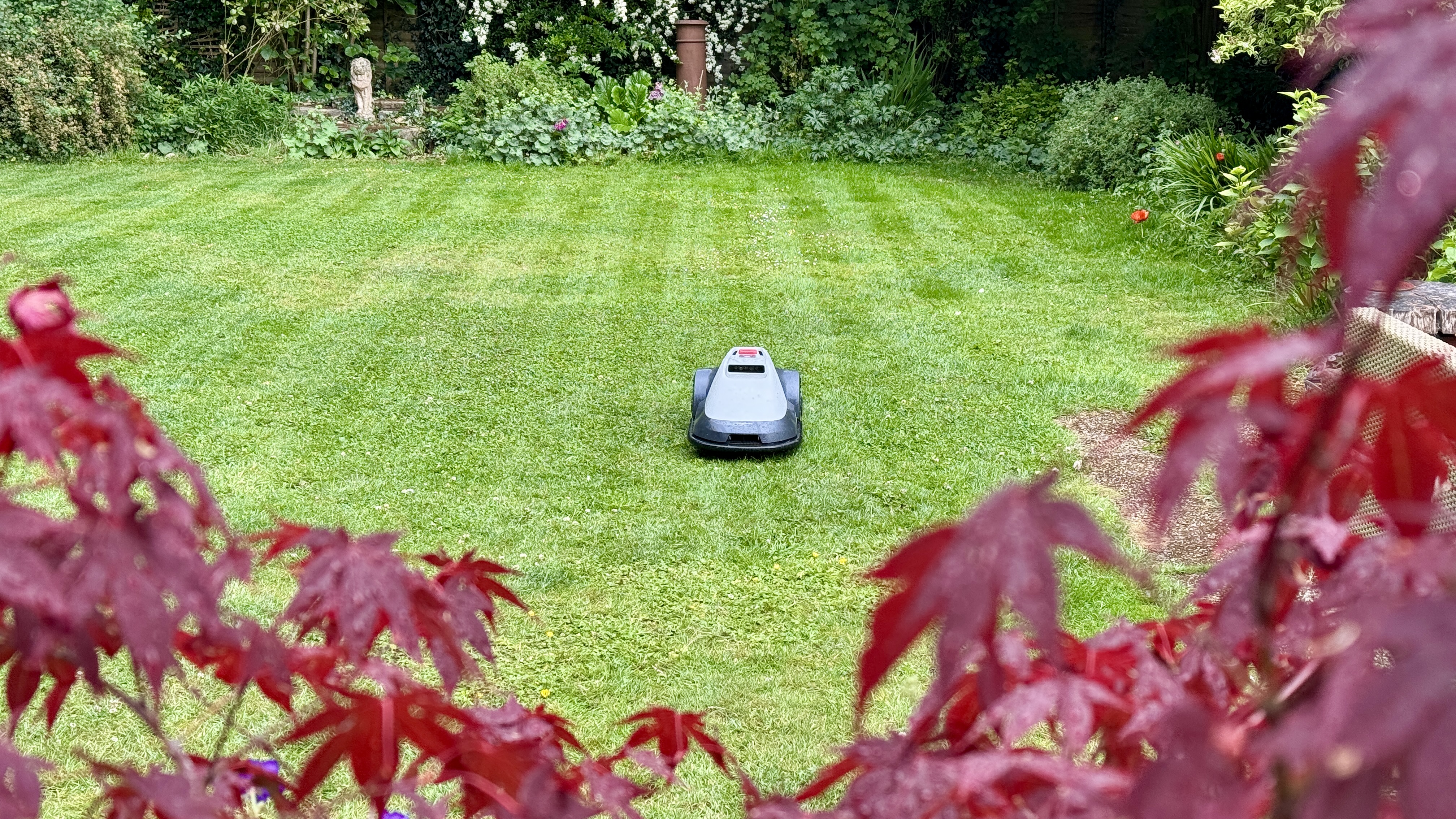 Eufy E15 robot lawn mower mowing tester&#039;s lawn in neat stripes
