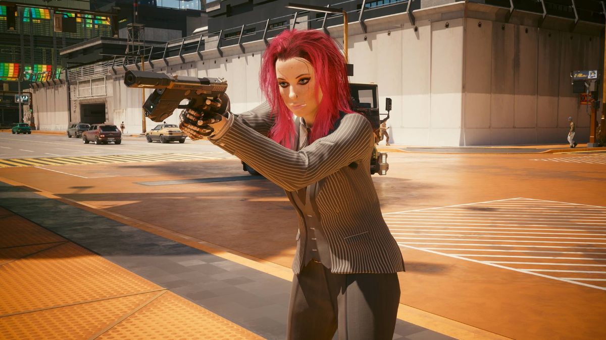 V in Cyberpunk 2077 with pink hair, wearing a suit and aiming a pistol on the side of the street.