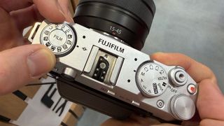 Mike Harris handling Fujifilm X-M5 on trade-show floor