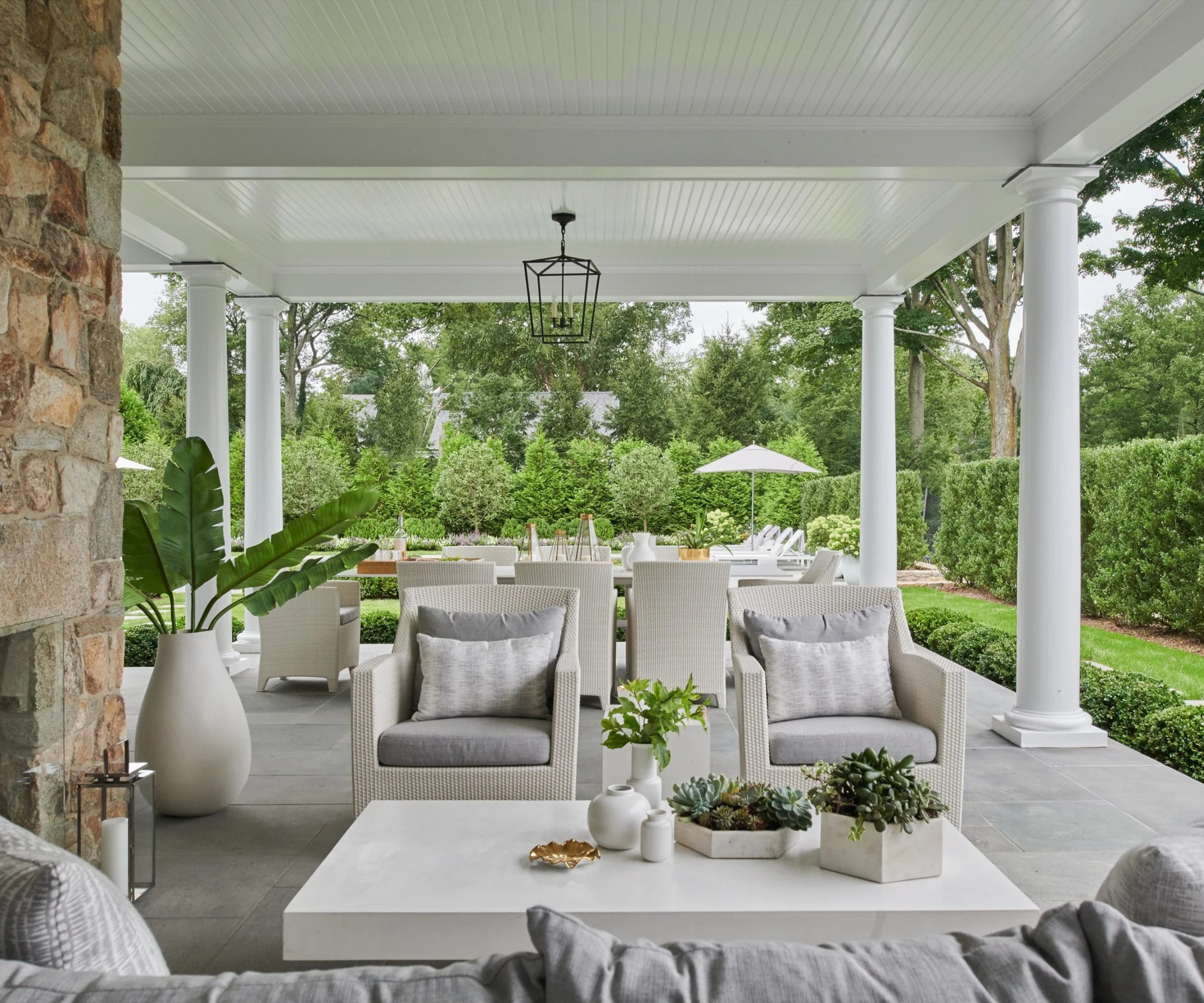 white outdoor seating area under porch