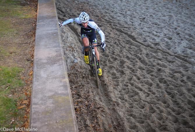 Curtis White (Cyclocrossworld.com) using the retaining wall to help balance in the sand