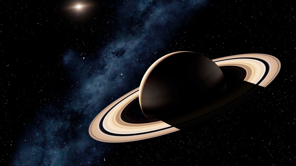 An illustration of Saturn with the sun visible in the far distance.