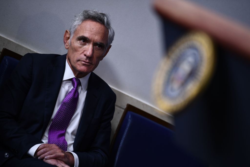 Member of the coronavirus task force Scott Atlas listens to US President Donald Trump during a briefing at the White House August 10, 2020, in Washington, DC.