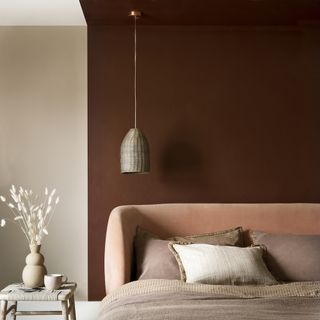 bedroom with dark brown wall and bedside table