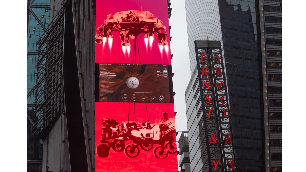 The live NASA TV broadcast from inside the Mission Support Area of NASA's Jet Propulsion Laboratory is seen on the One Times Square video board as NASA's Perseverance rover continues its descent towards the surface of Mars, Thursday, Feb. 18, 2021 in New York City.