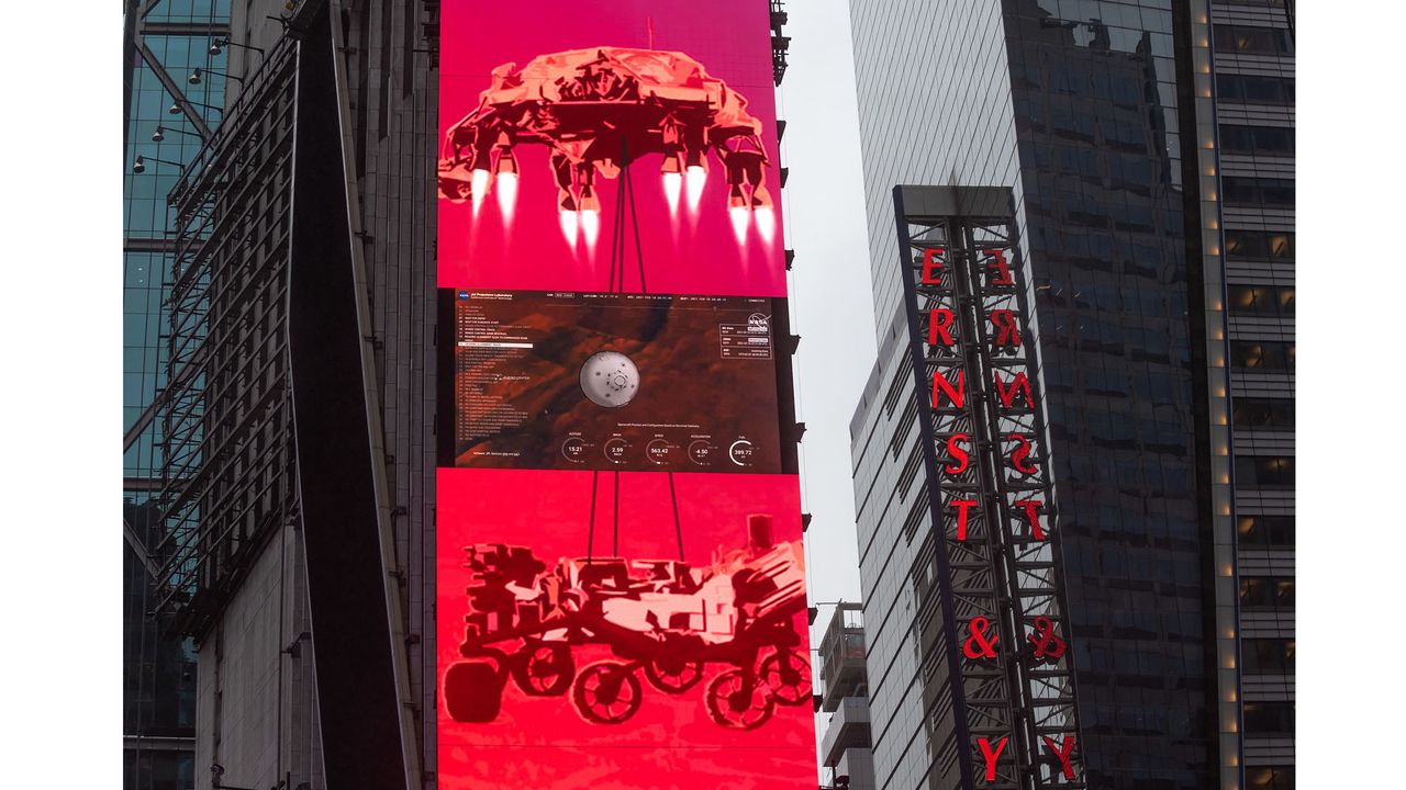 The live NASA TV broadcast from inside the Mission Support Area of NASA's Jet Propulsion Laboratory is seen on the One Times Square video board as NASA's Perseverance rover continues its descent towards the surface of Mars, Thursday, Feb. 18, 2021 in New York City.
