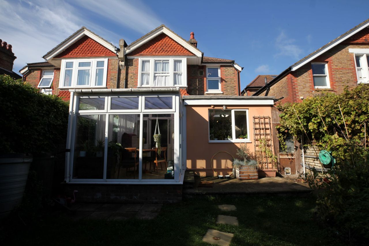 The old conservatory only extends slightly from the house and looks outdated
