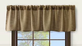 burlap-colored rustic valance over dark wood window