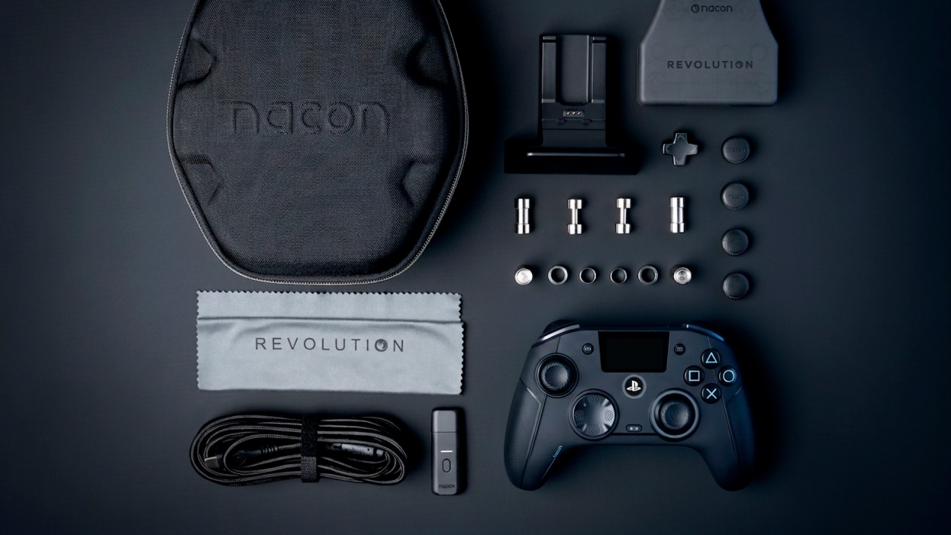 Nacon Revolution 5 Unlimited controller with accessories on a dark background