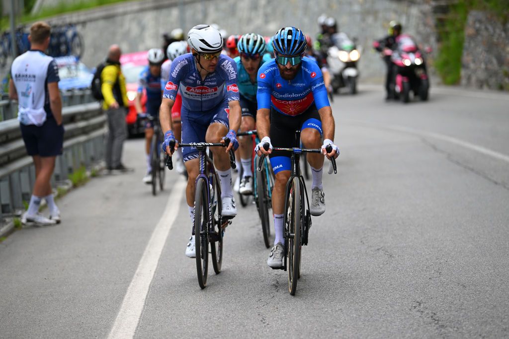 LIVIGNO MOTTOLINO ITALY MAY 19 LR Nicola Conci of Italy and Team Alpecin Deceuninck and Simon Geschke of Germany and Team Cofidis Blue Mountain Jersey compete in the breakaway during the 107th Giro dItalia 2024 Stage 15 a 222km stage from Manerba del Garda to Livigno Mottolino 2387m UCIWT on May 19 2024 in Livigno Mottolino Italy Photo by Dario BelingheriGetty Images