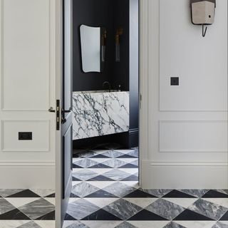 bespoke patterned stone flooring with white wall