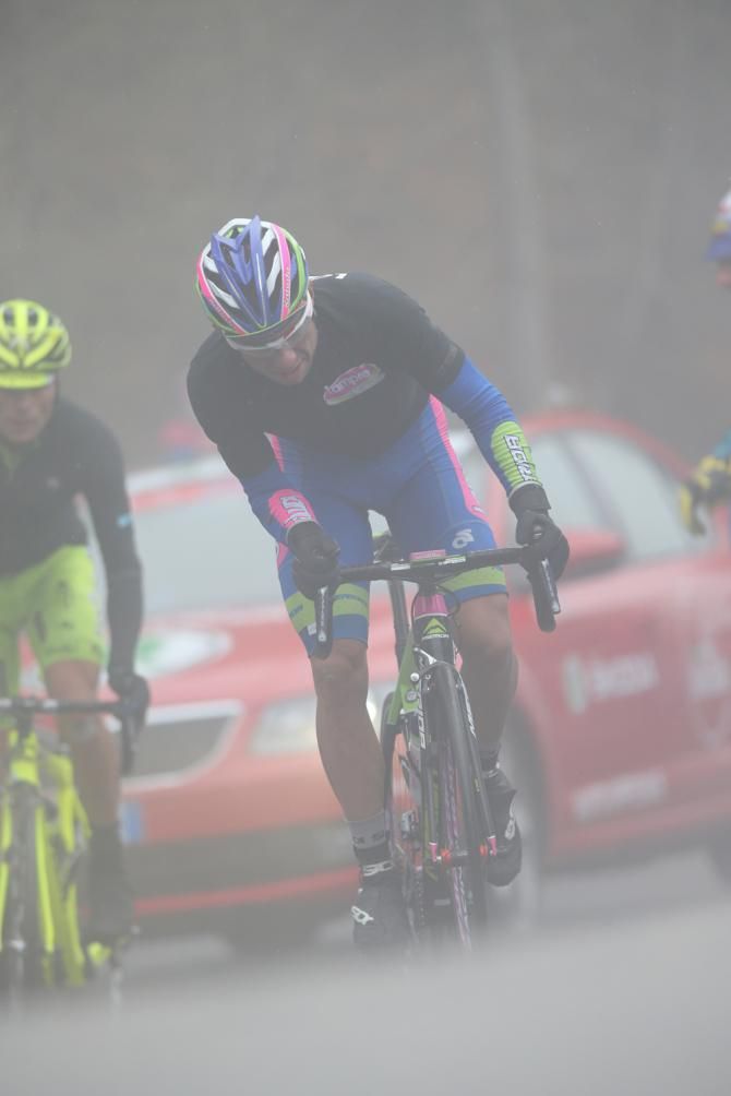 Riders battle with the weather and the gradient on stage 14