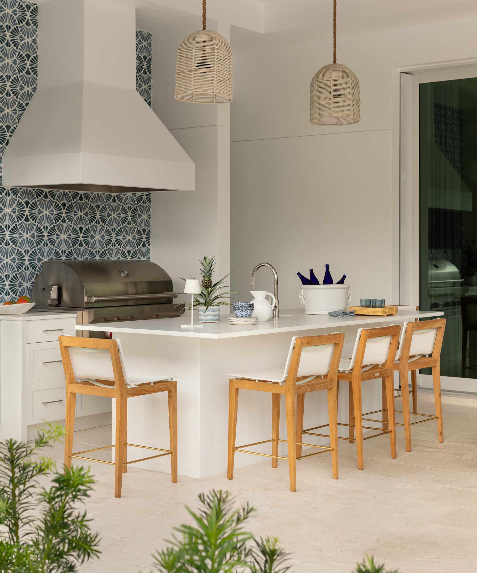outdoor kitchen with large cooker hood, grill and island