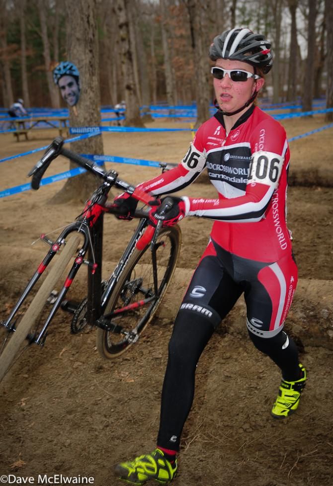 Emma White (Cyclocrossworld.com) running the log barriers early in the race