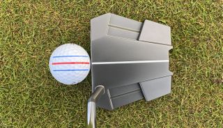 Odyssey Eleven putter showing off its cool crown design on the putting green