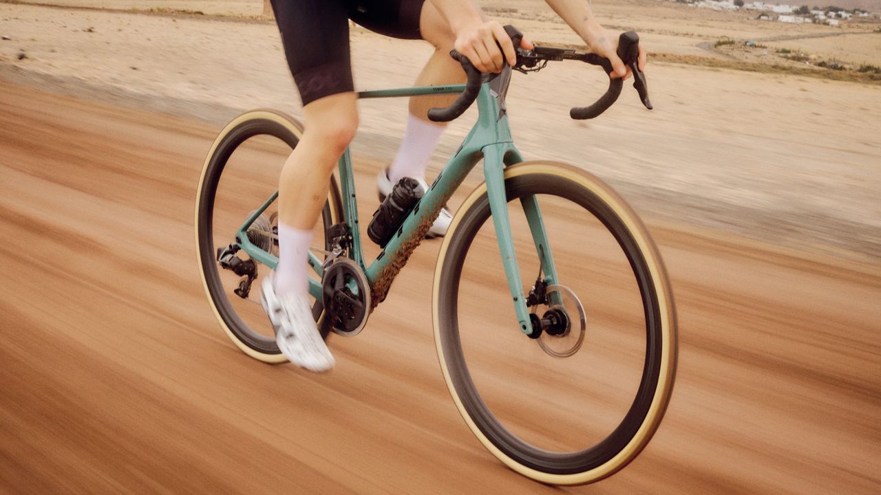 Vitus Veno EVO all-road bike being ridden on light gravel trails