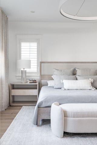 A crisp, cool coastal design-inspired bedroom using Benjamin Moore's Chantilly Lace and Decorator's White.