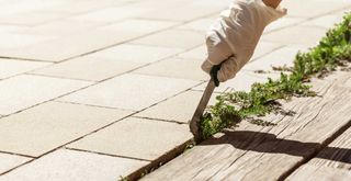 wedding a patio to show a key step for how to clean patio slabs