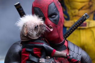 Deadpool holds Dogpool. Aww!