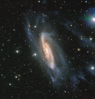 The European Southern Observatory's (ESO) Very Large Telescope in Chile captured this view of the spiral galaxy NGC 3981 in May 2018. The image was taken using the ESO's FORS2 instrument, as part of the Cosmic Gems program, which photographs the southern skies when conditions aren't good for scientific observations. An asteroid's trail can also be seen near the top, slightly right of center.