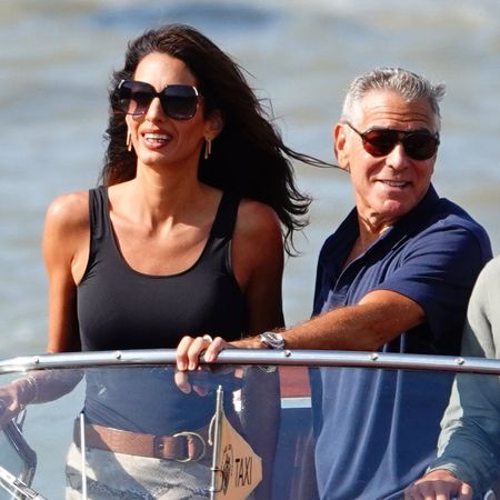 Amal Clooney Takes the Editor-Beloved Wedge Trend and a Sheer Snakeskin Skirt to Venice Film Festival