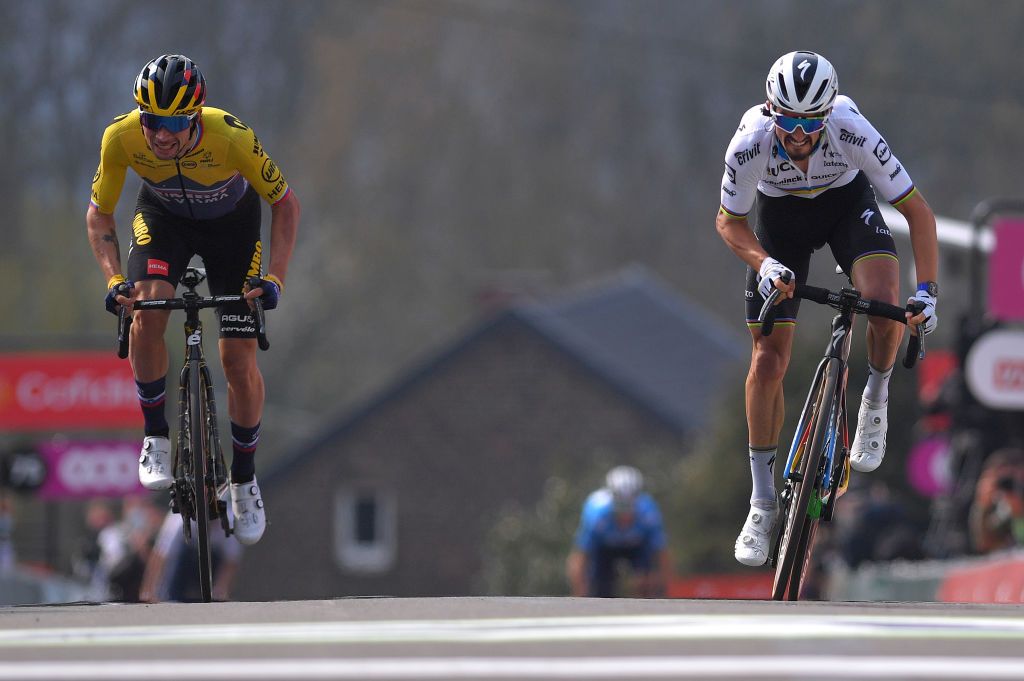 MUR DE HUY BELGIUM APRIL 21 Primoz Roglic of Slovenia and Team Jumbo Visma Julian Alaphilippe of France and Team Deceuninck QuickStep sprint on arrival during the 85th La Fleche Wallonne 2021 Men Elite a 1936km race from Charleroi to Mur de Huy 204m FlecheWallonne on April 21 2021 in Mur de Huy Belgium Photo by Luc ClaessenGetty Images