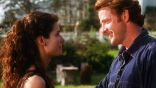 Aidan Quinn and Sandra Bullock looking at each other in Practical Magic.